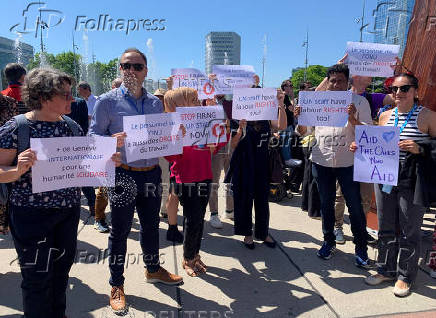 UN staff demonstrate about firing employees, outside the European headquarters, in Geneva