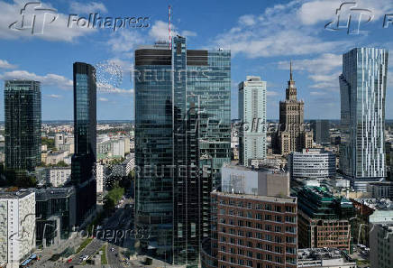 FILE PHOTO: General view of city skyscrapers with Palace of Culture and Science is seen in Warsaw