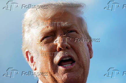 FILE PHOTO: U.S. President Donald Trump speaks to members of the media upon his arrival from Pennsylvania, at Joint Base Andrews