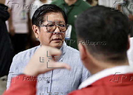 President Ferdinand Marcos visits a relief goods warehouse in Manila as Tropical Storm 'Crising apporaches