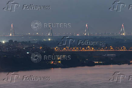 Lights illuminate the Nhat Tan bridge amidst air polution in Hanoi