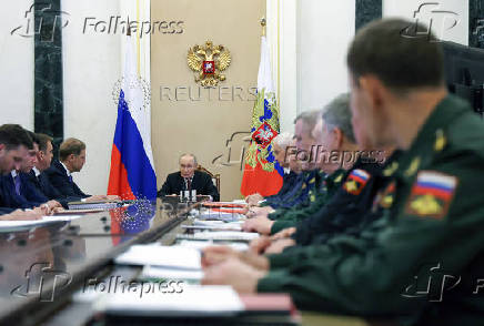 Russia's President Putin chairs a meeting with senior officials and military commanders in Moscow
