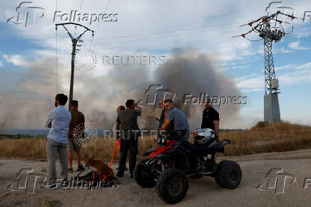 A wildfire burns on the outskirts of Valmojado