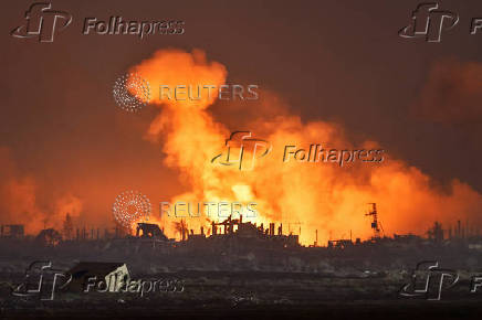 An explosion in Gaza is seen from the Israeli side of the Israel-Gaza border