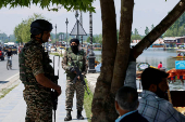 Indian security force personnel stand guard on the banks of Dal Lake, following a suspected militant attack near south Kashmir's Pahalgam, in Srinagar