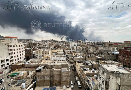 Smoke billows after an Israeli airstrike on Houthi infrastructure, in Sana'a
