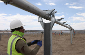 Construction work on solar power arrays continues at rPlus Energies' Green River Energy Center in Emery