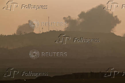 Smoke rises following an Israeli air strike, near the Israel-Gaza border