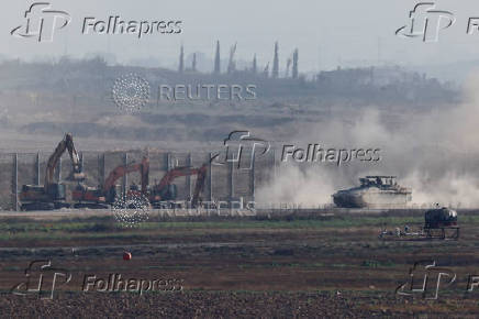 An Israeli APC manoeuvres on the Israeli side of the Israel-Gaza border,