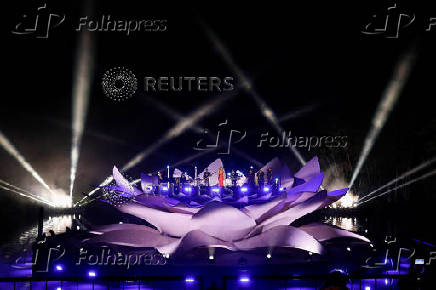 Mariah Carey performs on a floating stage shaped like a giant Victoria amazonica water lily at the Guama River in Belem