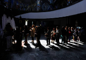 Worshippers gather for the celebrations for the Passion of the Lord at the Church of Saint Clement of Ohrid, on Good Friday, in Skopje