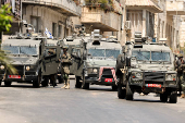 Israeli soldiers take part in an Israeli raid in Nablus