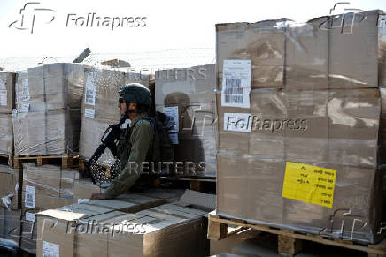 Humanitarian aid is waited to be transferred into Gaza from Israel, at the Gaza part of the Kerem Shalom crossing in the Gaza Strip