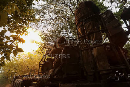 Servicemen of the Ukrainian Armed Forces fire a self-propelled gun toward Russian positions on a front line in Donetsk region