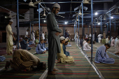 Students participate in Fajr prayer at a madrasa in Multan
