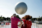 The return of a new Paris 2024 flame cauldron set on a balloon to the Tuileries Garden and the Paris skyline