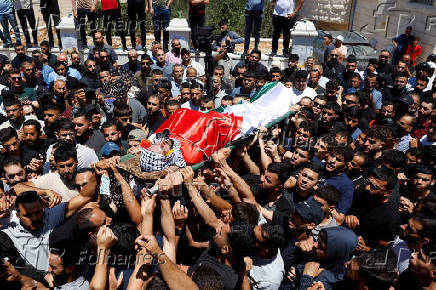 Mourners take part in the funeral of Mohammad Al-Shalabi, near Ramallah