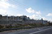 Israeli authorities encircle Palestinian town in West Bank with a fence, restricting free movement of residents