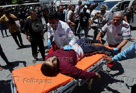 Palestinian casualties are brought into Al-Aqsa Martyrs Hospital, following an Israeli strike, in Deir al-Balah