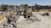 A drone view shows the damaged Christ the King Church in Deir el-Zor