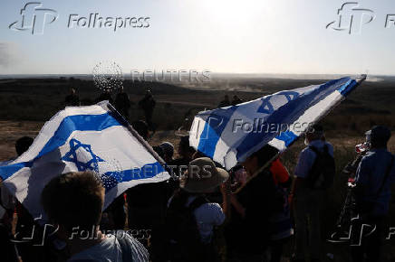 Israeli right wing activists take part in a rally organized by settlers groups to promote Israel's resettling in Gaza
