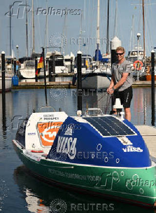 German stand-up paddler Michael Walther takes to the Baltic Sea for a test run in Kiel