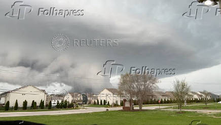 A general view shows funnel clouds in Spring Hill