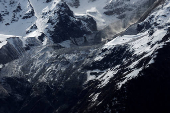 Debris and dust from a crumbling glacier that partially collapsed and tumbled onto the village of Blatten
