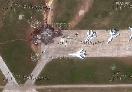 FILE PHOTO: A satellite image shows a destroyed TU 22 aircraft in the aftermath of a drone strike at the Belaya air base