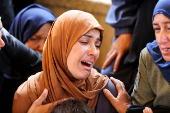 Funeral of a Palestinian killed, in what the Gaza health ministry says was Israeli fire near a distribution center in Rafah, at Nasser hospital in Khan Younis