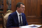 Russian President Vladimir Putin meets with Sports Minister Mikhail Degtyarev