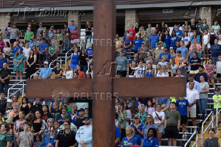 People attend a prayer service for flood victims in Kerrville