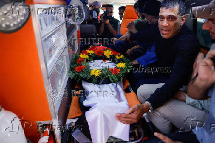 Mourners take part in the funeral of of Sayfollah Kamel Musallet, killed amid the Israel-Gaza conflict, near Ramallah