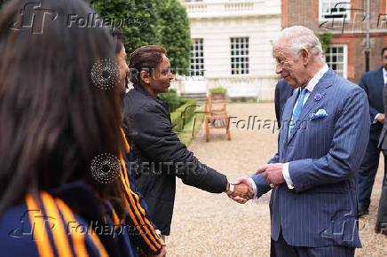 King Charles III meets members of the India men's and women's Test cricket teams in London