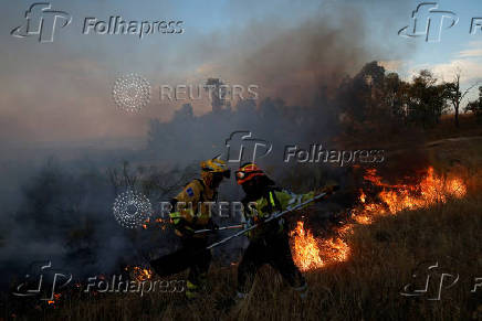 A wildfire burns on the outskirts of Valmojado
