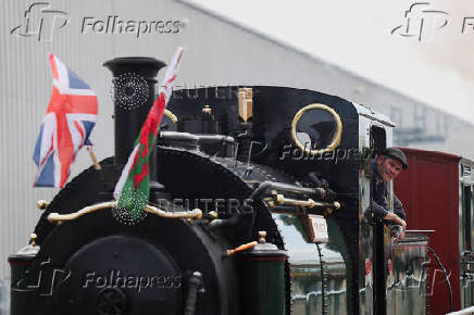 A staff on the Ffestiniog & Welsh Highland Railways looks out during 'The Greatest Gathering', a railway festival marking 200 years of rail history, at Alstom?s Litchurch Lane factory in Derby