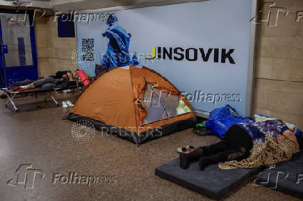 People take shelter inside a metro station during an air raid alert in Kyiv