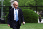 Peter Navarro speaks to the media outside the White House