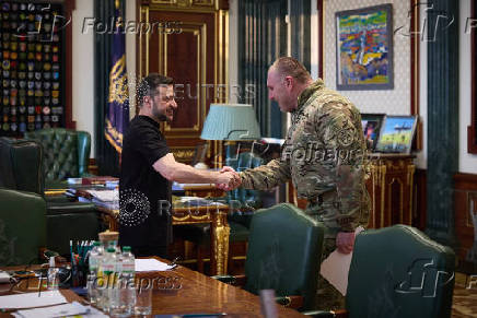Ukraine's President Zelenskiy and Head of the Security Service of Ukraine Maliuk shake hands during their meeting in Kyiv