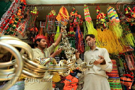 Roadside shop sells ornaments ahead of Eid al-Adha in Peshawar