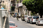 Israeli soldiers take part in a Israeli raid in Nablus