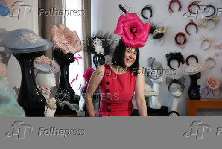 Milliner Merve Bayindir wears one of her hat creations as she speaks to Reuters ahead of the Ascot horse racing festival, in London