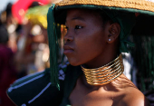 A model takes part in a fashion competition during the Durban July horse race in Durban