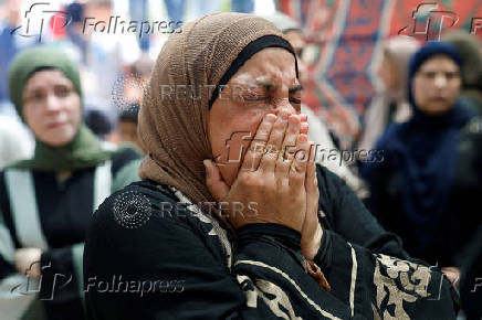 Mourners take part in the funeral of Mohammad Al-Shalabi, near Ramallah