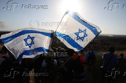 Israeli right wing activists take part in a rally organized by settlers groups to promote Israel's resettling in Gaza