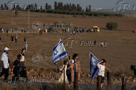 Israeli right wing activists take part in a rally organized by settlers groups to promote Israel's resettling in Gaza