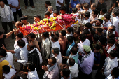 People carry the body of Smit Parmar, who was killed in a suspected militant attack near Pahalgam in south Kashmir, for his last rites in Bhavnagar