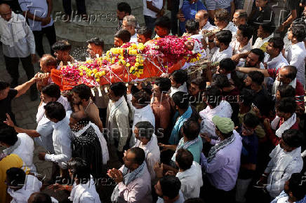 People carry the body of Smit Parmar, who was killed in a suspected militant attack near Pahalgam in south Kashmir, for his last rites in Bhavnagar