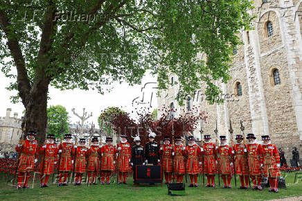 Britain's Queen Camilla views an installation of 30,000 ceramic poppies commemorating the 80th anniversary of Victory in Europe (VE) Day in London