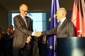 German Chancellor Olaf Scholz hands over to his successor Friedrich Merz